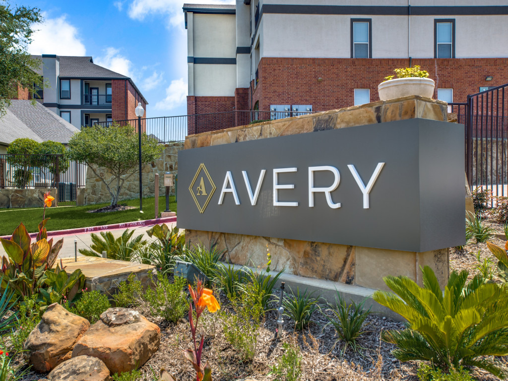 external view of Avery with close-up of signage and landscaping